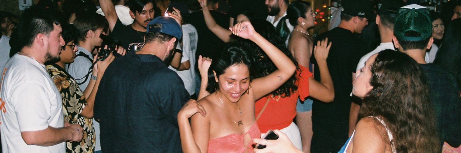 a group of people dancing at a party
