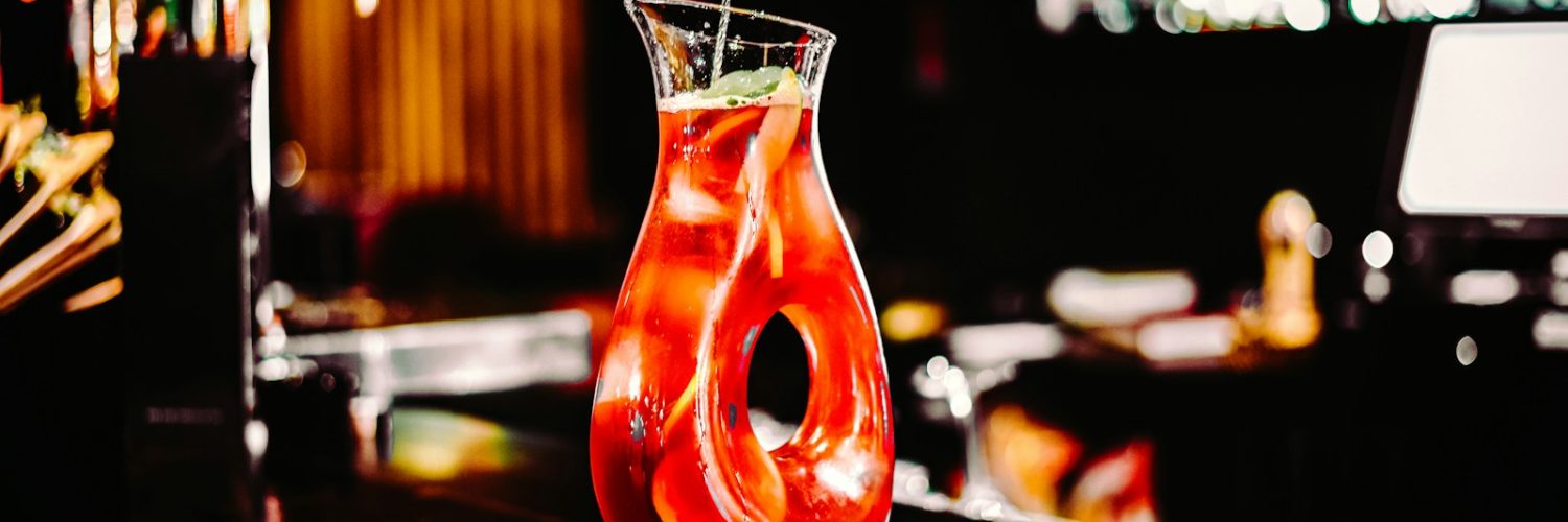 clear drinking glass with orange liquid